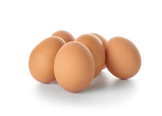Raw chicken eggs on white background