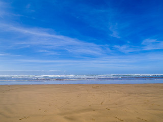 Fototapeta na wymiar Sandy beach on the coast in Essaouira, Morocco