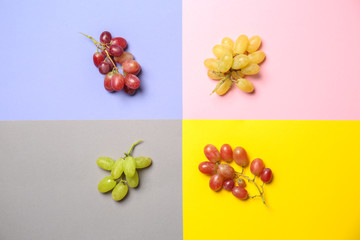 Ripe sweet grapes on colorful background