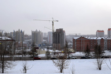Fototapeta na wymiar Construction crane. Construction of houses. The City Of Krasnoyarsk.