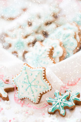 Christmas decoration with cookies in the shape of snowflakes and stars on a white background. Top view.