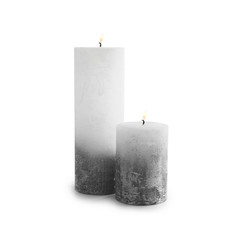 Burning candles on white background
