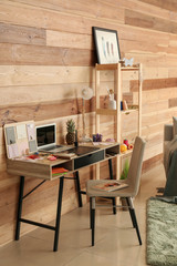 Stylish workplace of designer with modern laptop