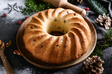 Traditional homemade Christmas pie on dark table