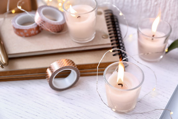 Fototapeta na wymiar Beautiful burning candles on table