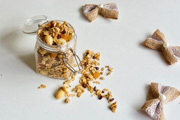 Tasty homemade granola in the glass jar.