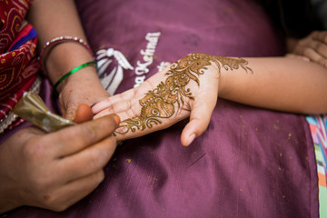 applying henna on hand, Hindu wedding ,Rajasthan, India