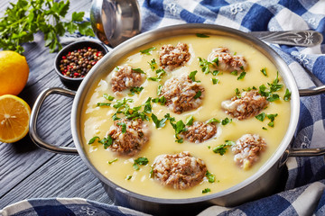 close-up of Greek Meatball Soup - Giouvarlakia