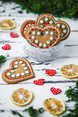 Gingerbread Cookies hearts in a cup on a white wooden background. Valentines day concept