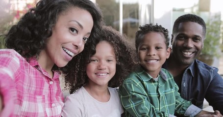 African American family taking a selfie - Powered by Adobe