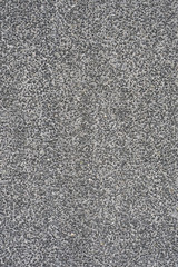 Small stones texture, road, asphalt background, gray pattern fon, wall construction, non-colored cement footage, small crumb background. Wall texture background.