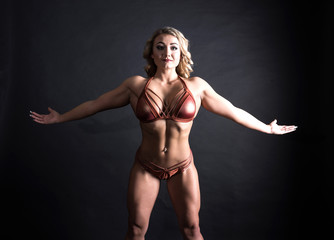 Fototapeta na wymiar Portrait of a muscular young woman. 