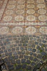 Cobbled entrance mixed with antique traditional faded tiles