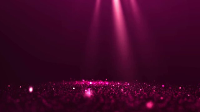 Glittering particles of ruby ​​color with spotlights and dust on blurred background. Intro invitation card.