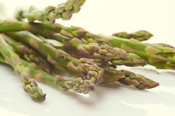 fresh green asparagus on light background