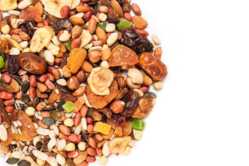 Nuts, dried fruits, figs - a delicious snack lies in a semicircle on a white background