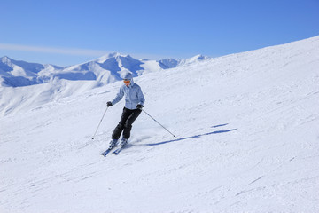 Fototapeta na wymiar Skier on skiing trace in Georgia skiing resort