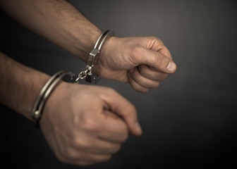 Man hand handcuffs
