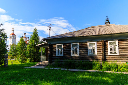 Wooden house with carved polisade in Totma. Russian traditional architecture lies in wooden houses with manually carved decorations, often painted in white.