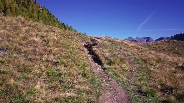Following hiking trail in Swiss Alps
