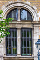 Window with arch and bars.