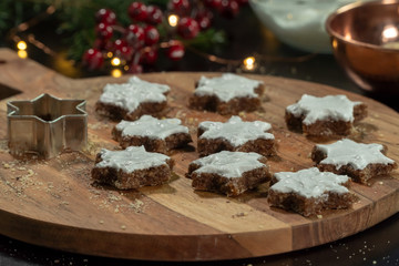 Preparing Zimtsterne (Cinamon Stars) on a rustical wooden cutting board