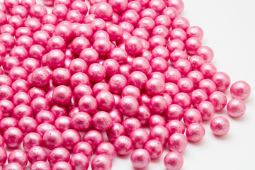 Multi-colored pearls on a white background