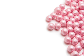 Multi-colored pearls on a white background
