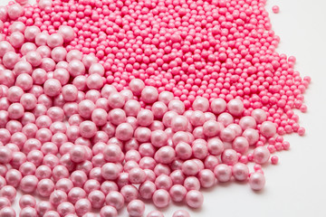 Multi-colored pearls on a white background
