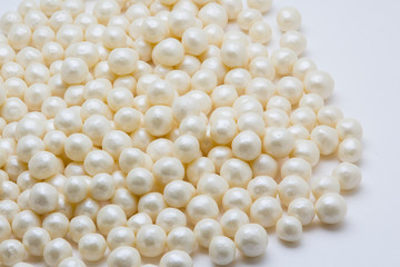 Multi-colored pearls on a white background