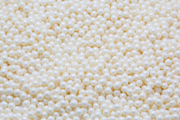 Multi-colored pearls on a white background