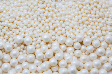 Multi-colored pearls on a white background