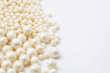 Multi-colored pearls on a white background