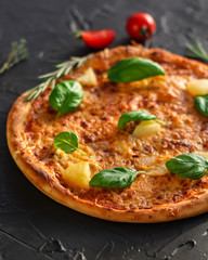 pizza, pineapple, chicken, tomato sauce, cheese, basil (pizza ingredients). Hawaiian pizza. Top view. copy space