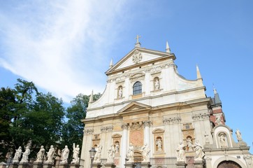 Fototapeta na wymiar Saints statues in front of church in Krakow, Poland