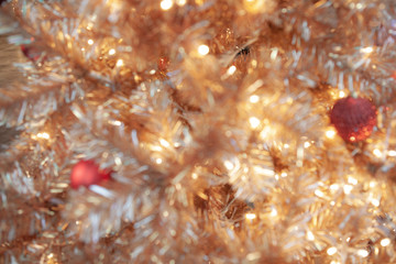 Abstract. Blurred. Season Greeting. Vintage Golden and Red Christmas background. Sparkling ball...