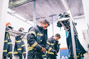 Firemen preparing for emergency service.