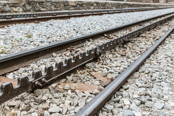 Detail of a cogwheel railway in mountains