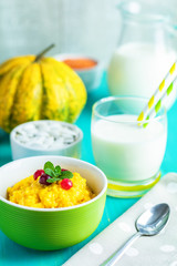 Delicious homemade pumpkin porridge with cranberry and mint