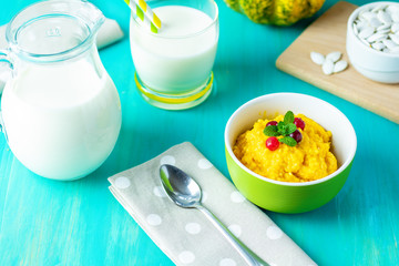 Delicious homemade pumpkin porridge with cranberry and mint