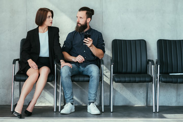 woman touching mans knee. work harassment flirt and seduction.