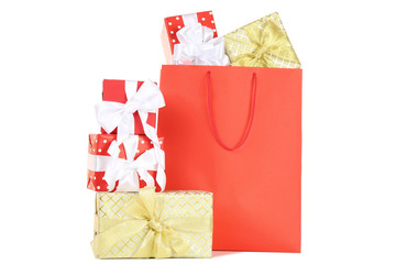 Shopping bag with gift boxes isolated on white background