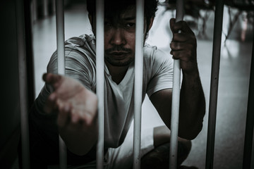 Hands of men desperate to catch the iron prison,prisoner concept,thailand people,Hope to be free.