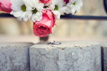 bridal bouquet with wedding rings