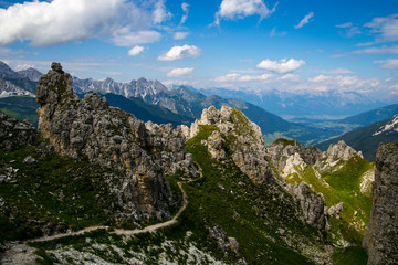 Valley in the Alps (Austria, Europe). Beautiful nature, high mountains, summer day, snowy peaks. Hike in the rocks, traveling with a backpack.