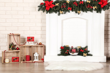 Christmas decorations with fireplace on brick wall background
