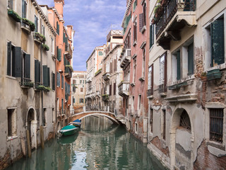 Obraz na płótnie Canvas VENICE, ITALY, NOV 1st, 2018: Traditional narrow canal street and colorful facades of old medieval houses. Classic Venezia or Venice cityscape