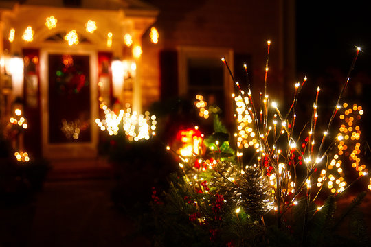 Blurred Christmas Background. Shining Christmas Decorations Outside The House