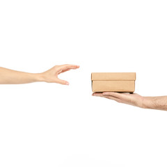 Two hands taking a box gift on white background isolation