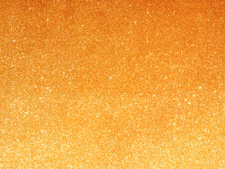 Golden fabric background with light reflections.Soft focused luxury holiday background.